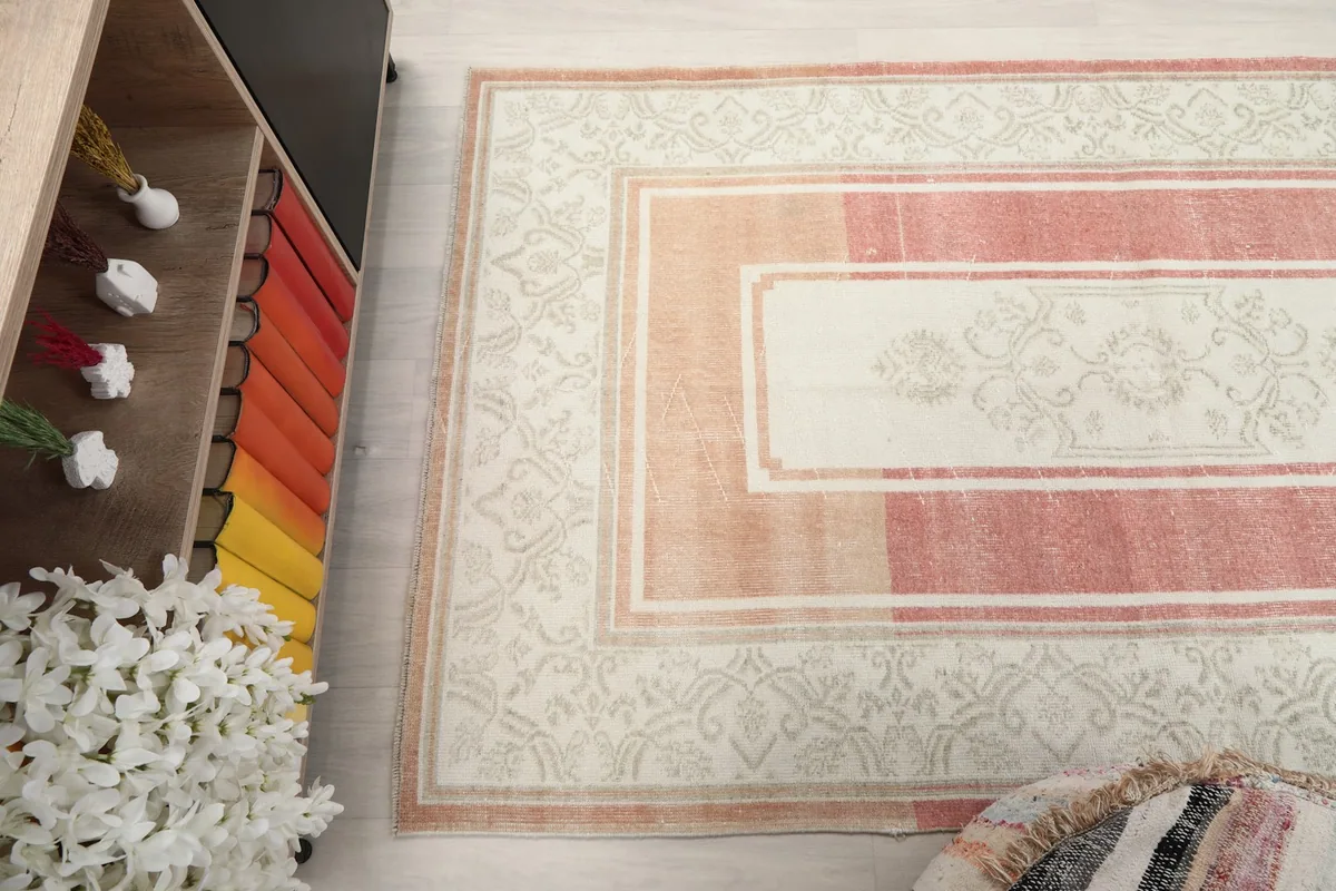 Overhead view of a section of the rug, highlighting the distinct color blocks and patterns.