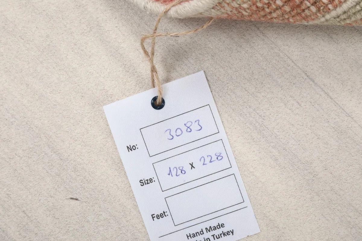 Product tag attached to the rug, displaying its unique number and dimensions.