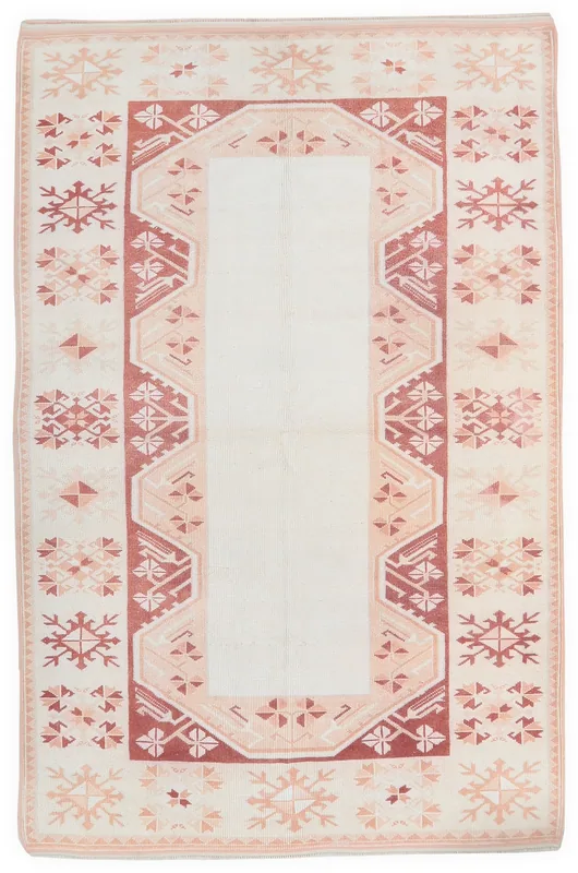 Full overhead view of the ivory and rust geometric hand-knotted vintage Anatolian rug