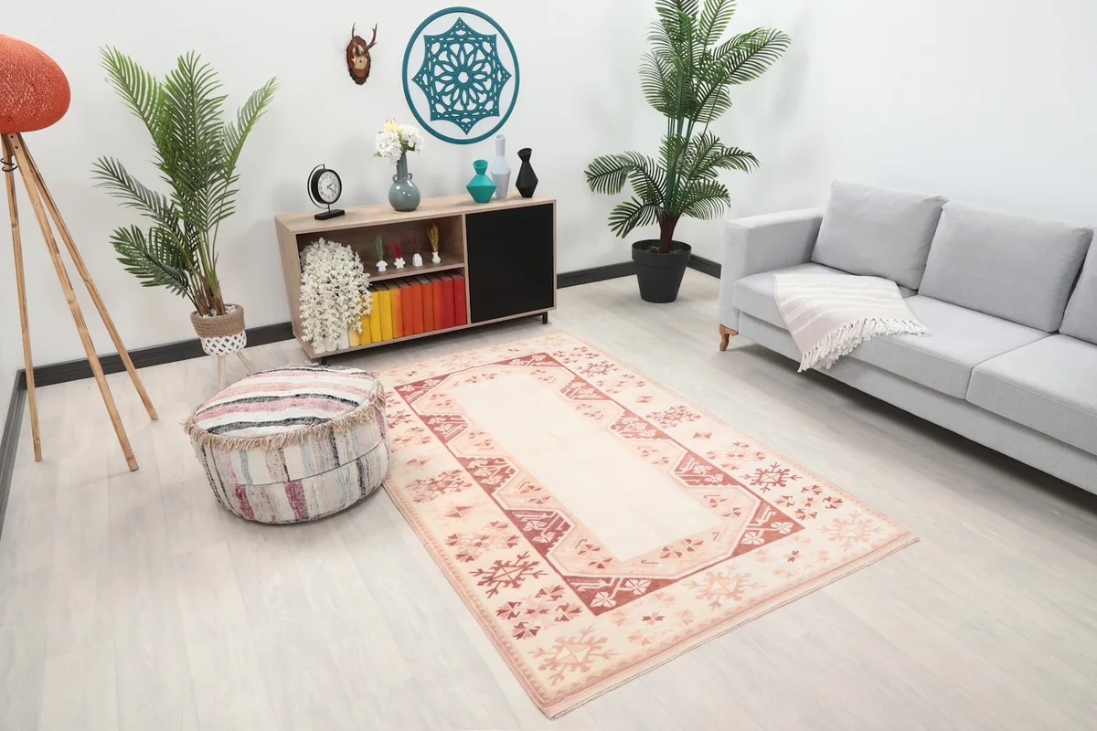 Angled view of the vintage Anatolian rug on a light floor in a contemporary living space