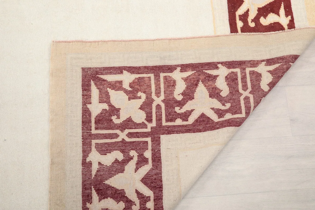 Another folded corner view, revealing the rug's construction and reverse side