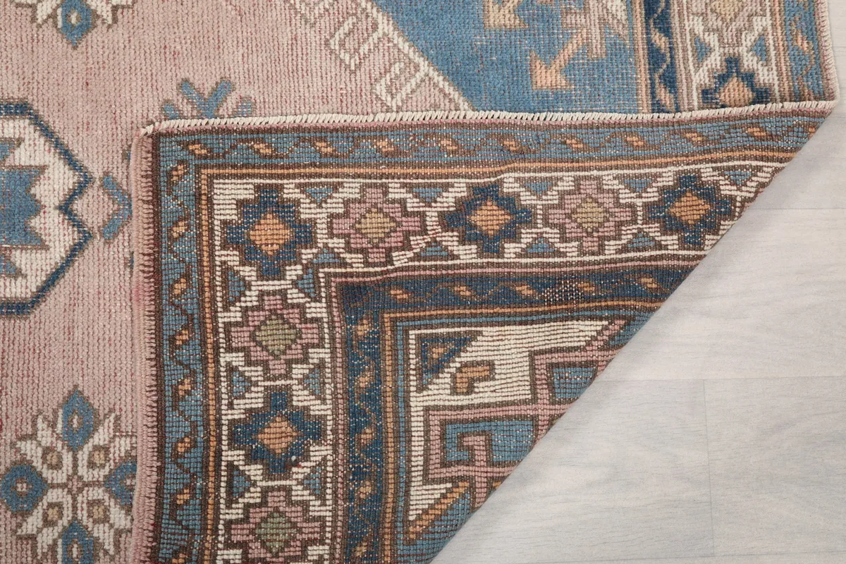 Another view of the rug's back, revealing the tight knotting and craftsmanship.