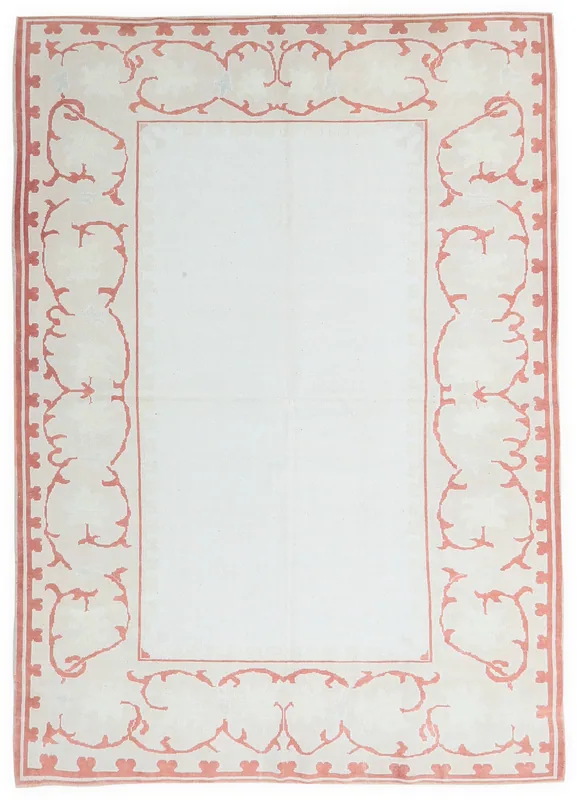 Full top view of the vintage Anatolian rug with an ivory field and rose border.