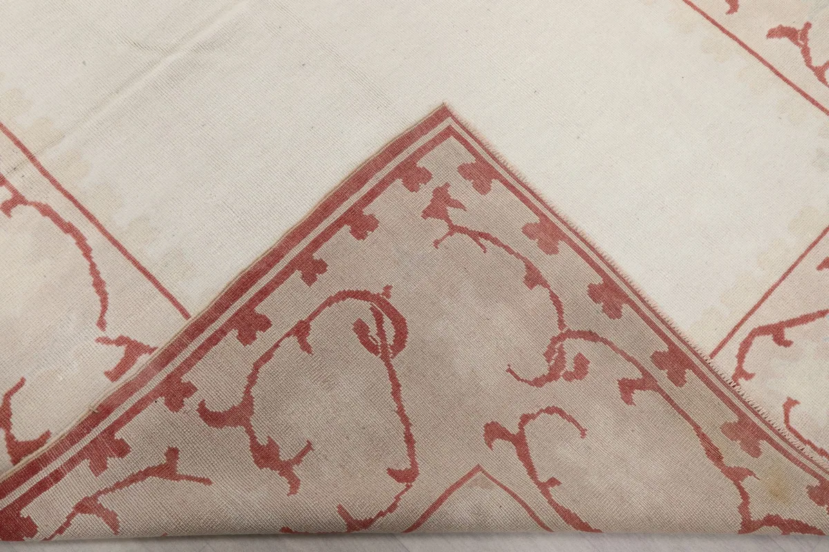 Folded corner of the rug, revealing the thickness and construction of the piece.