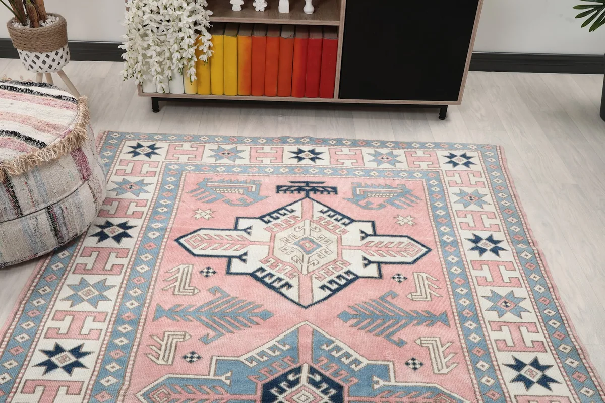 Overhead view of the rug in a room, highlighting its placement and colors