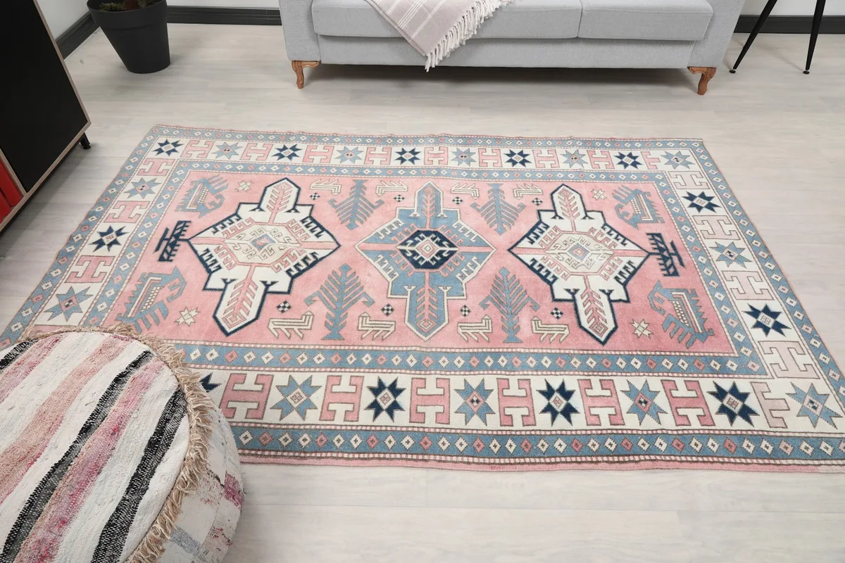 Full view of the rug in a living room, showcasing its medium size and design