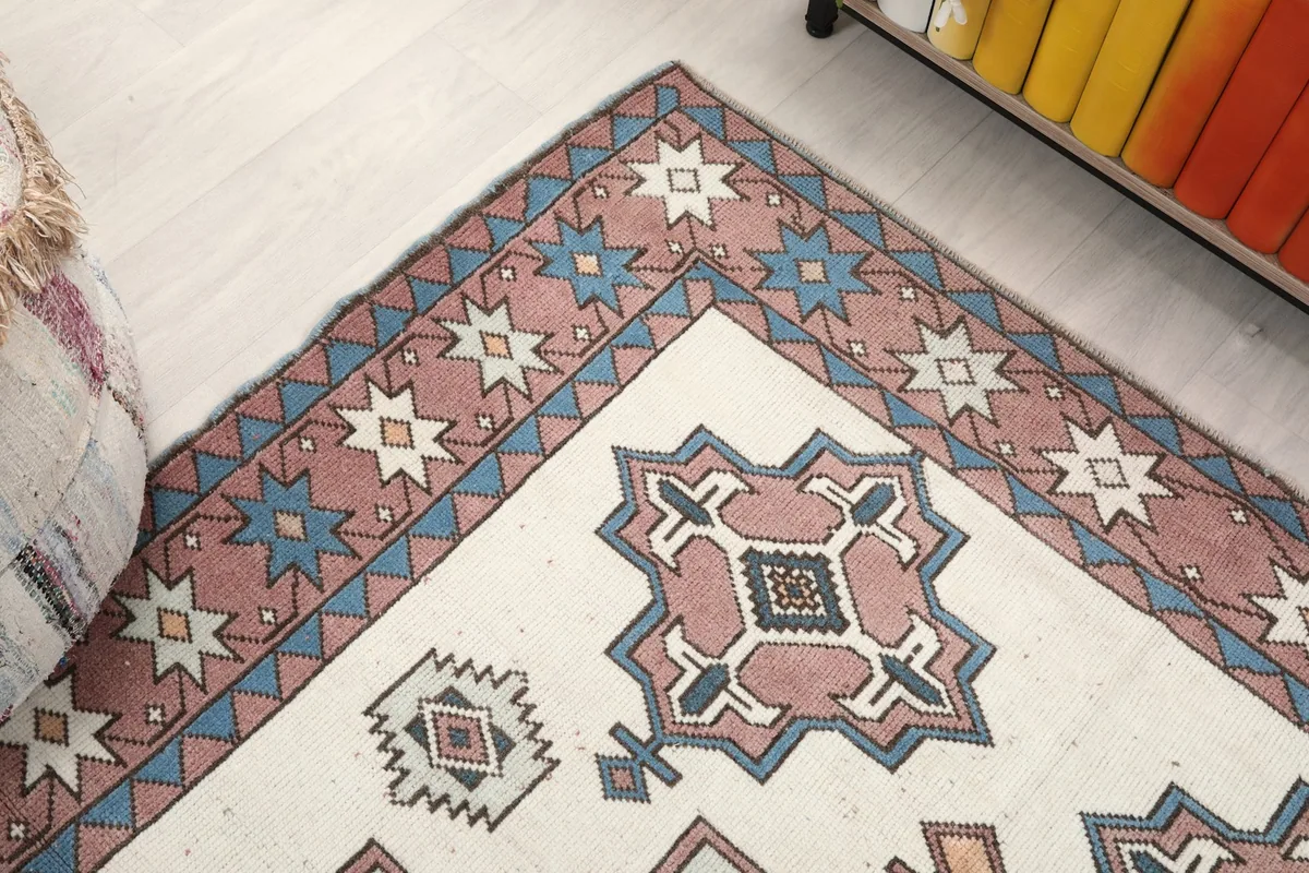 Corner view of the rug, showing the border design and field motifs