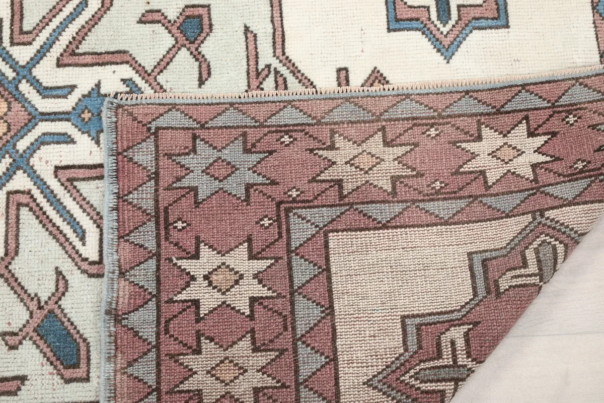 Another view of the rug's underside, showing the cotton foundation