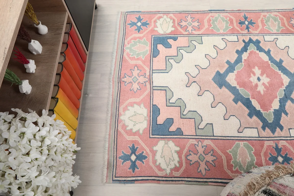 Angled view from above, capturing the rug's full pattern and the surrounding floor