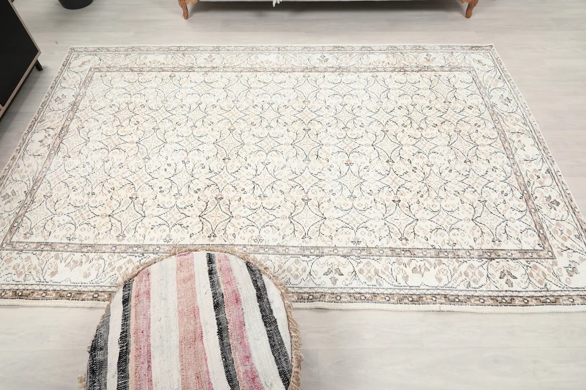 Overhead shot of the ivory rug, emphasizing its rectangular shape and design symmetry