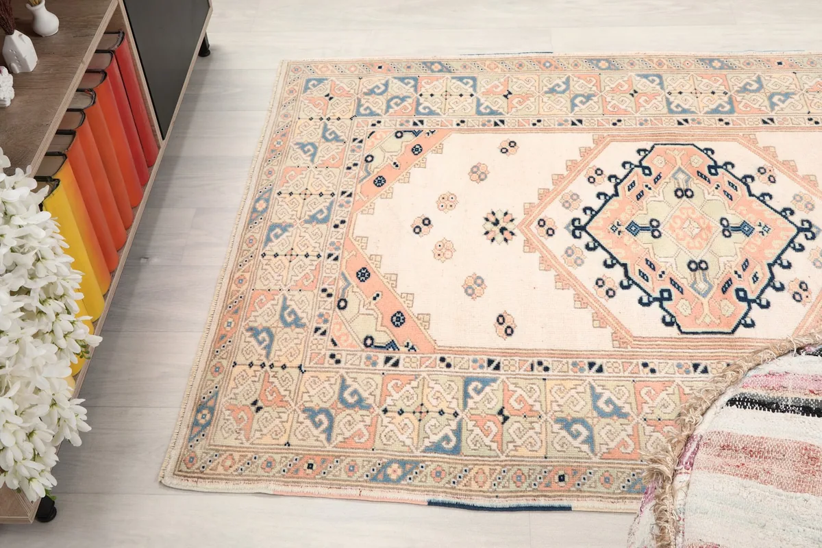 Diagonal view of the rug on the floor, capturing the full width and part of the length