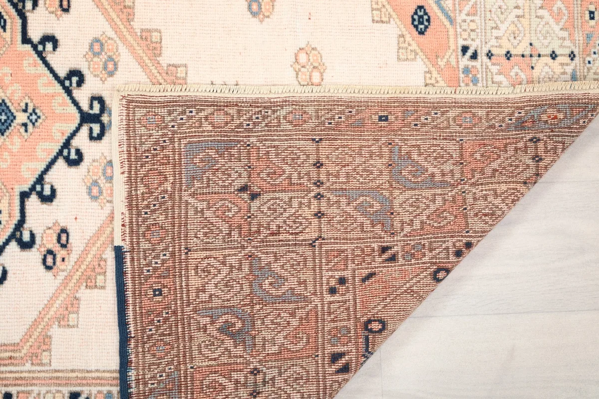 Close-up of the back of the rug, showing the dense knotting and craftsmanship