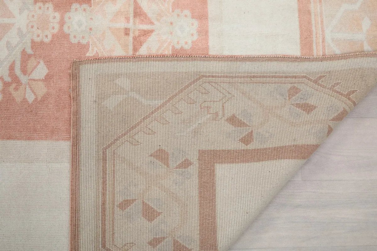 Close-up of the rug's reverse side, revealing the hand-knotted construction