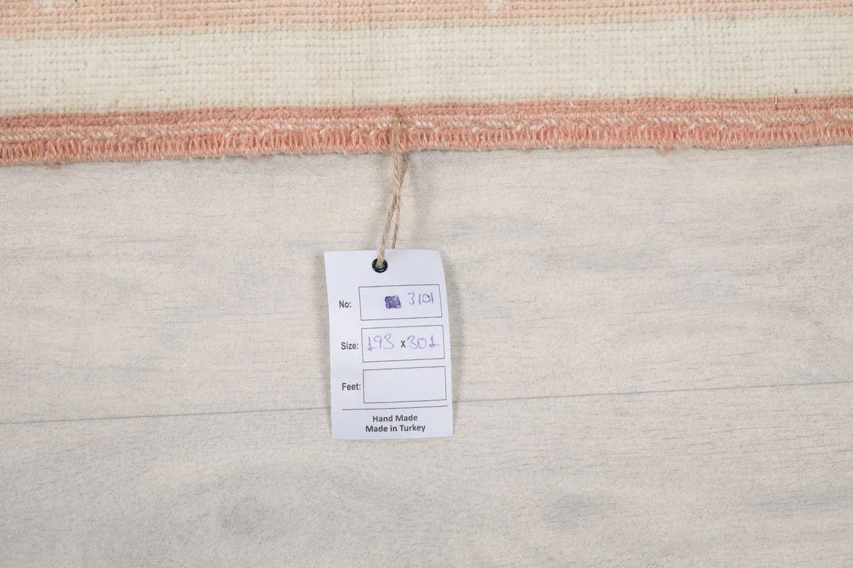 Product tag showing rug size and origin, 'Hand Made in Turkey'