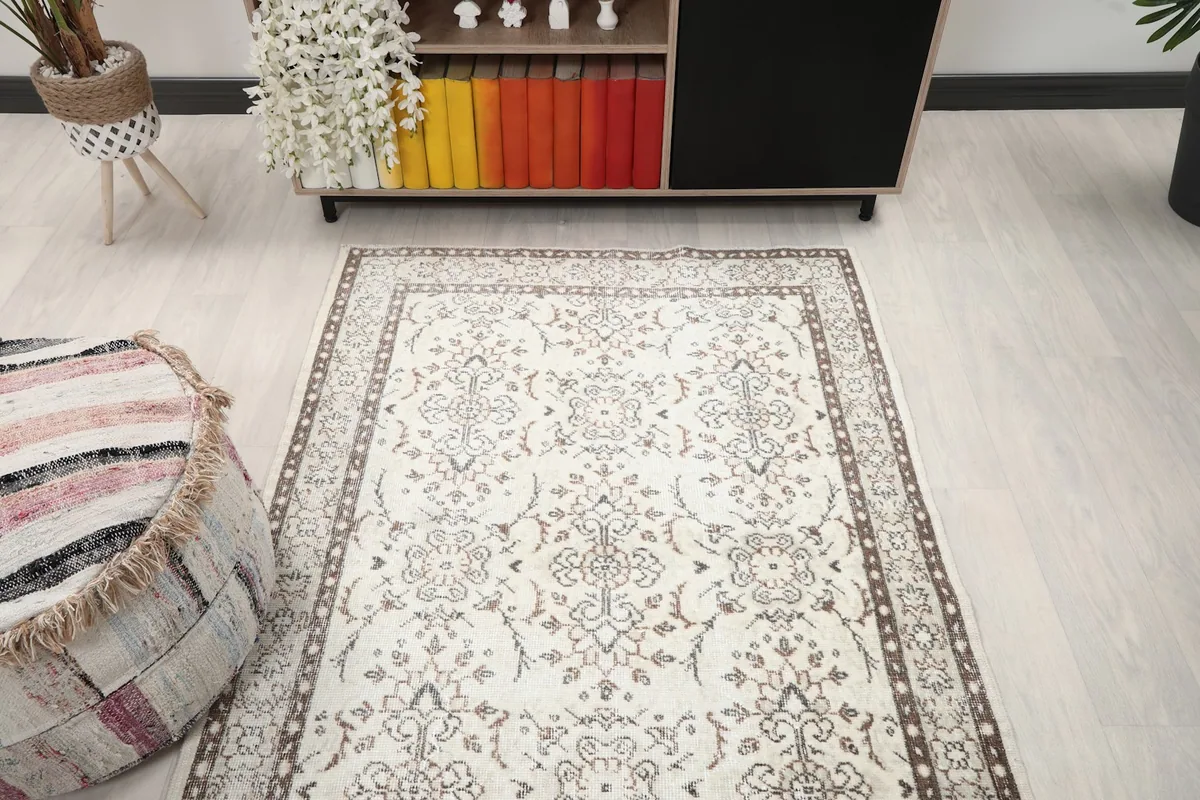 Straight-on view of the rug in the living room, emphasizing its size and pattern within the space.