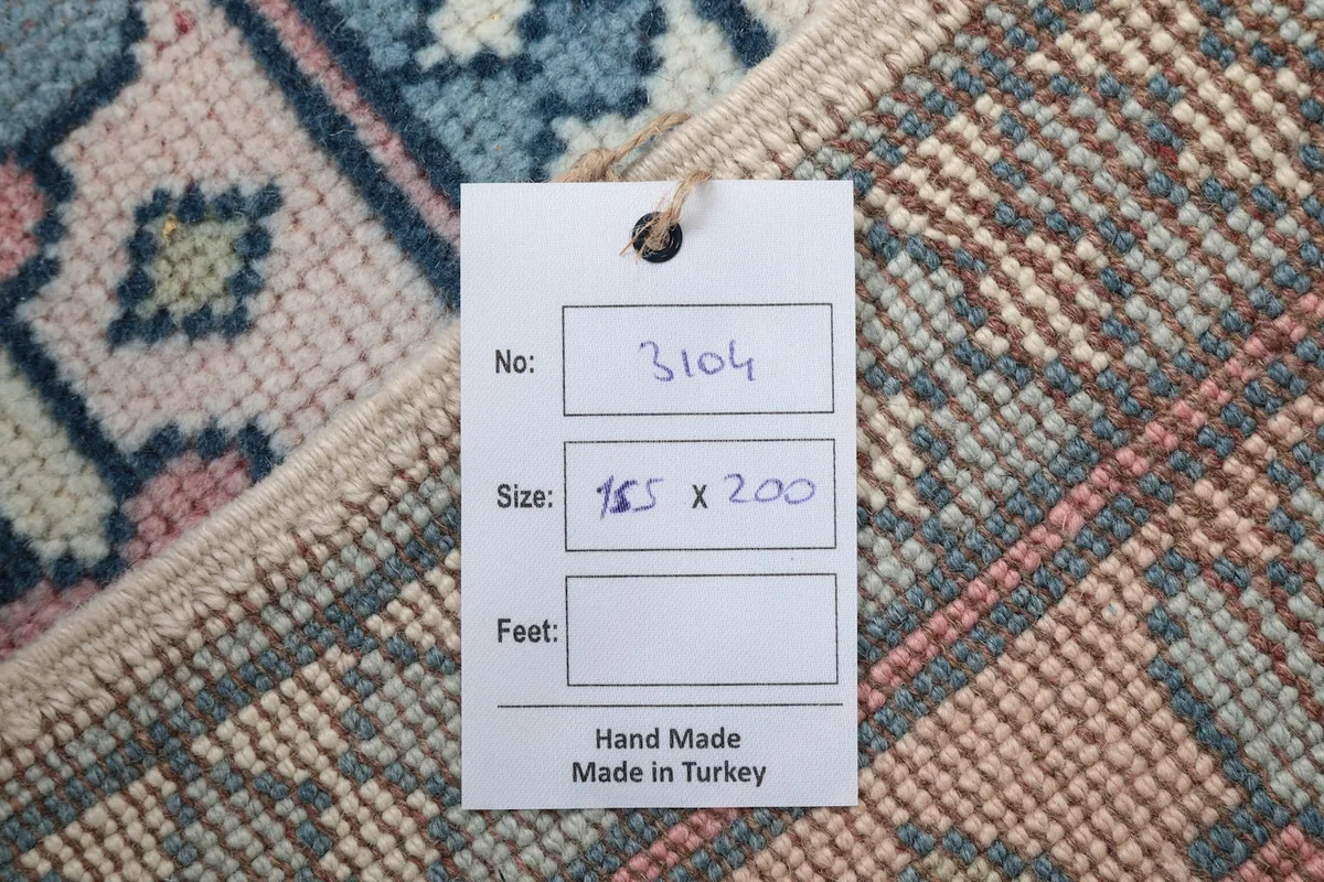 Tag indicating the rug's number, size in centimeters, and 'Hand Made in Turkey'