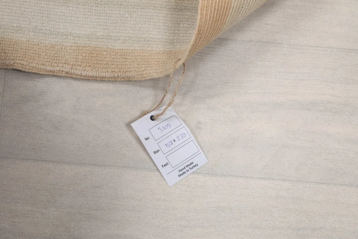 Product tag displaying size and origin details attached to the rug
