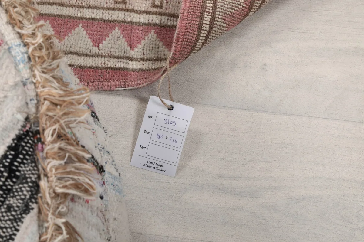 Tag showing the rug size 6'1" x 7'1" and origin Anatolia, Turkey