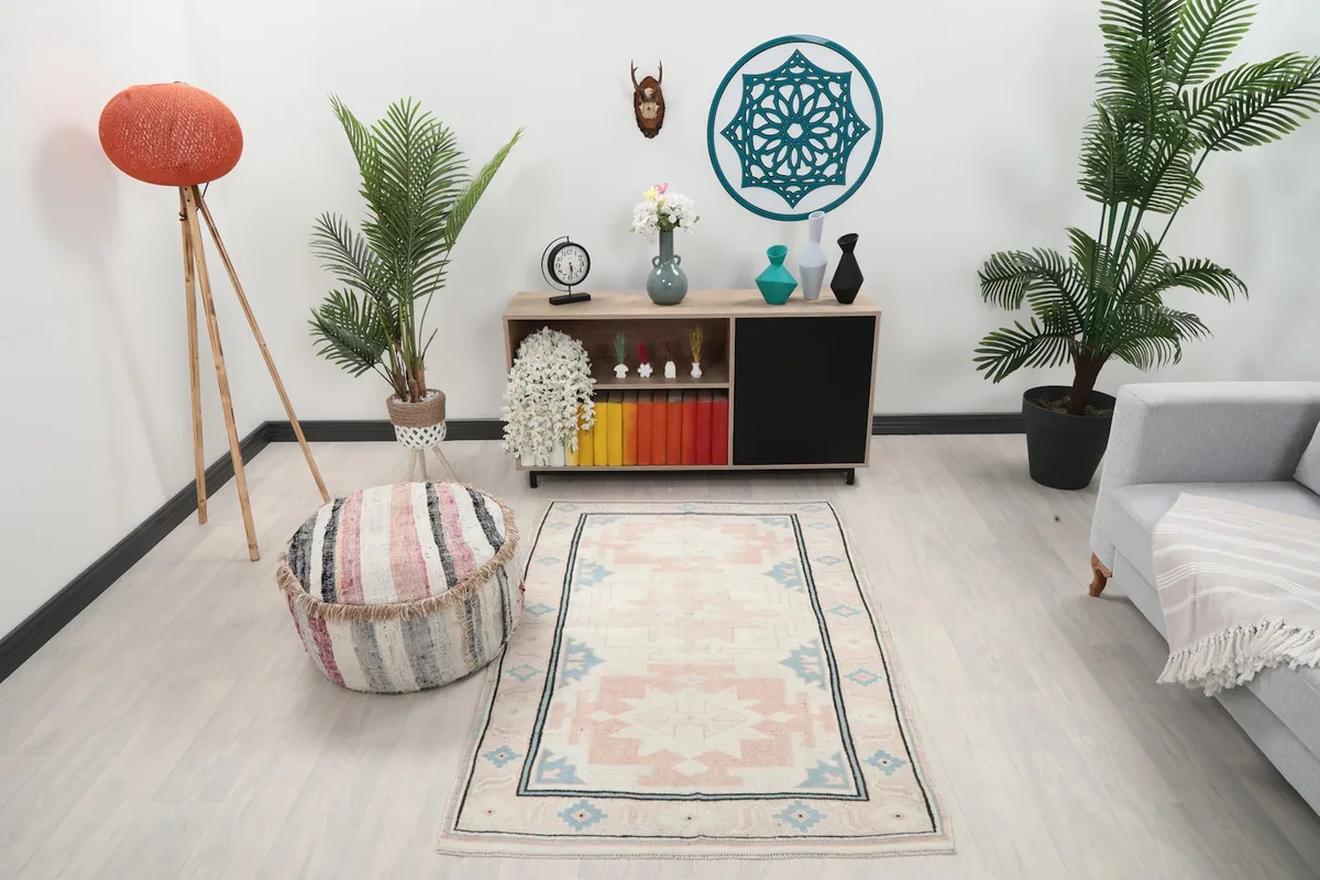 Vintage rug displayed in a room setting with modern furniture.