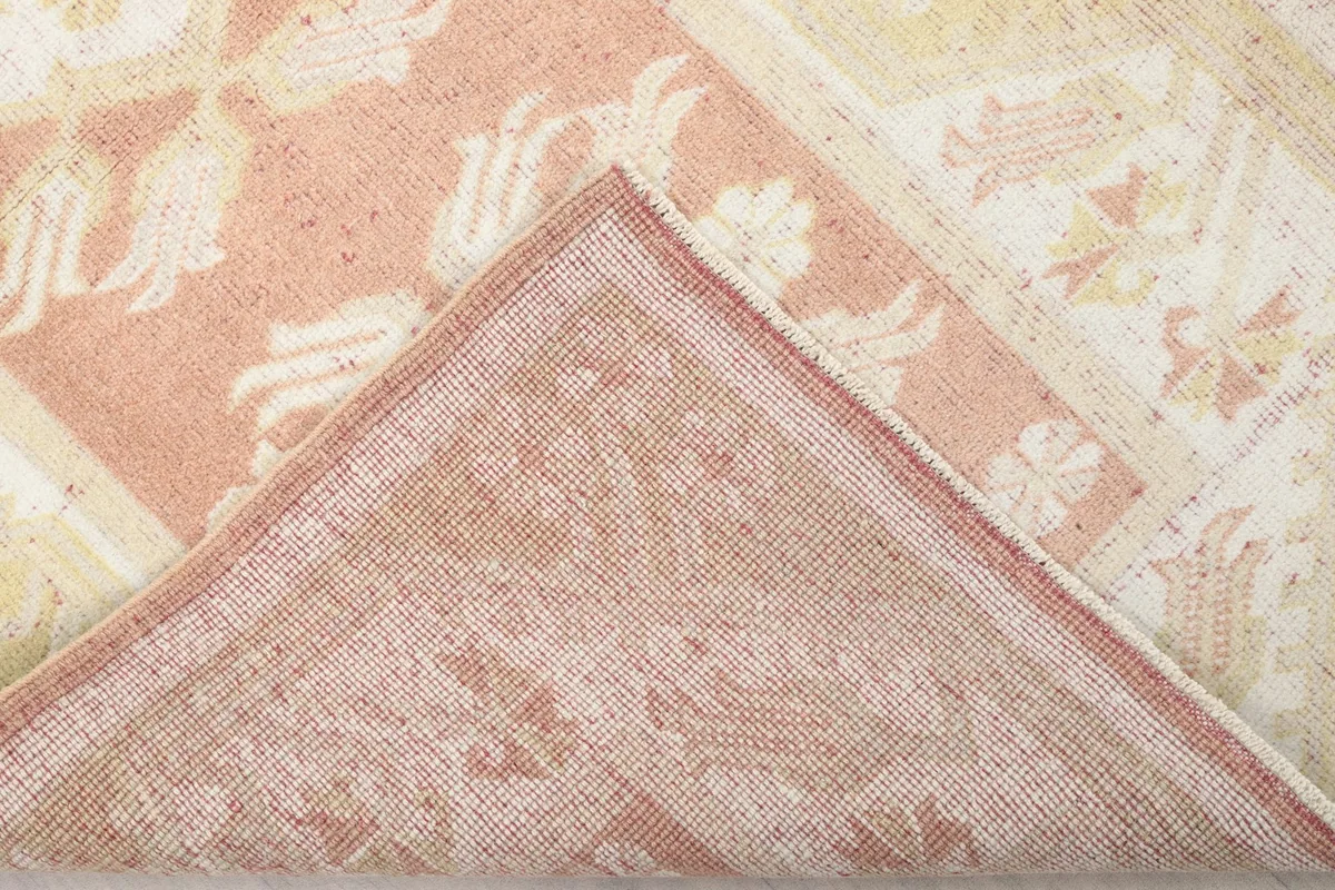 View of the back of the hand-knotted runner rug, revealing its construction and foundation