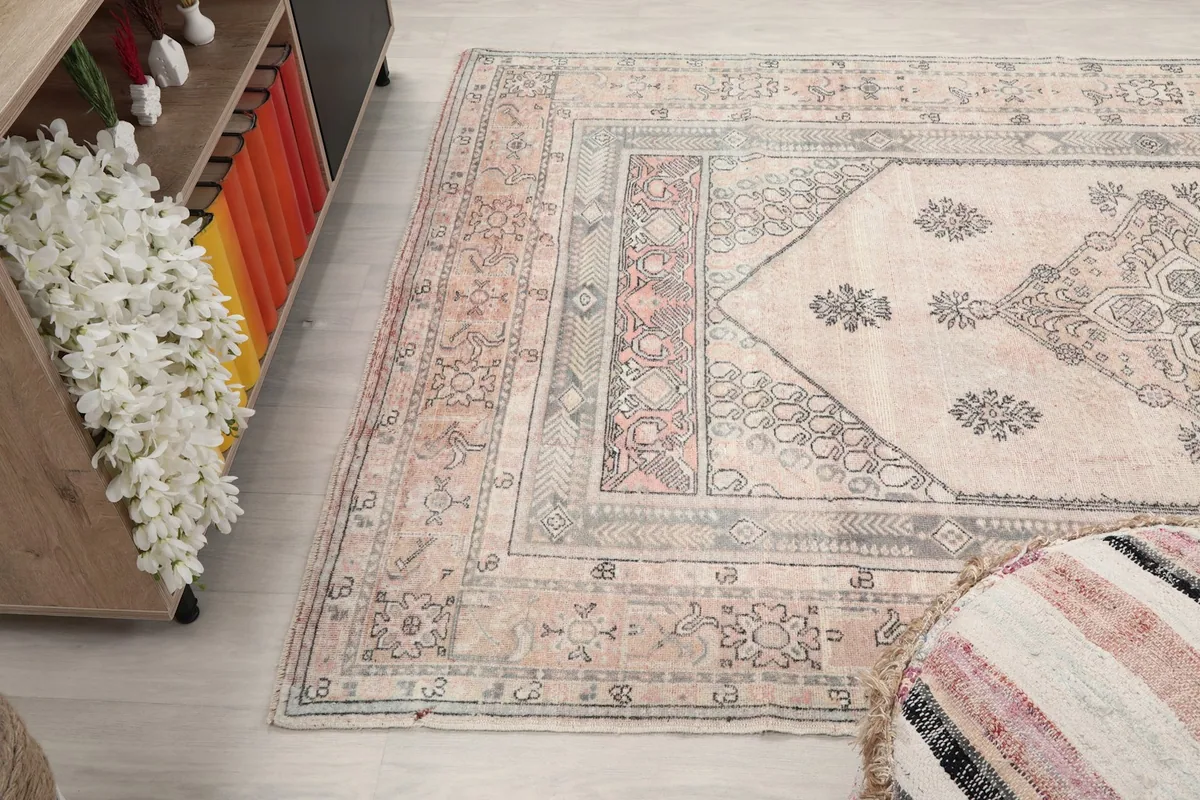 Angled view of the rug, capturing its texture and the interplay of colors and patterns