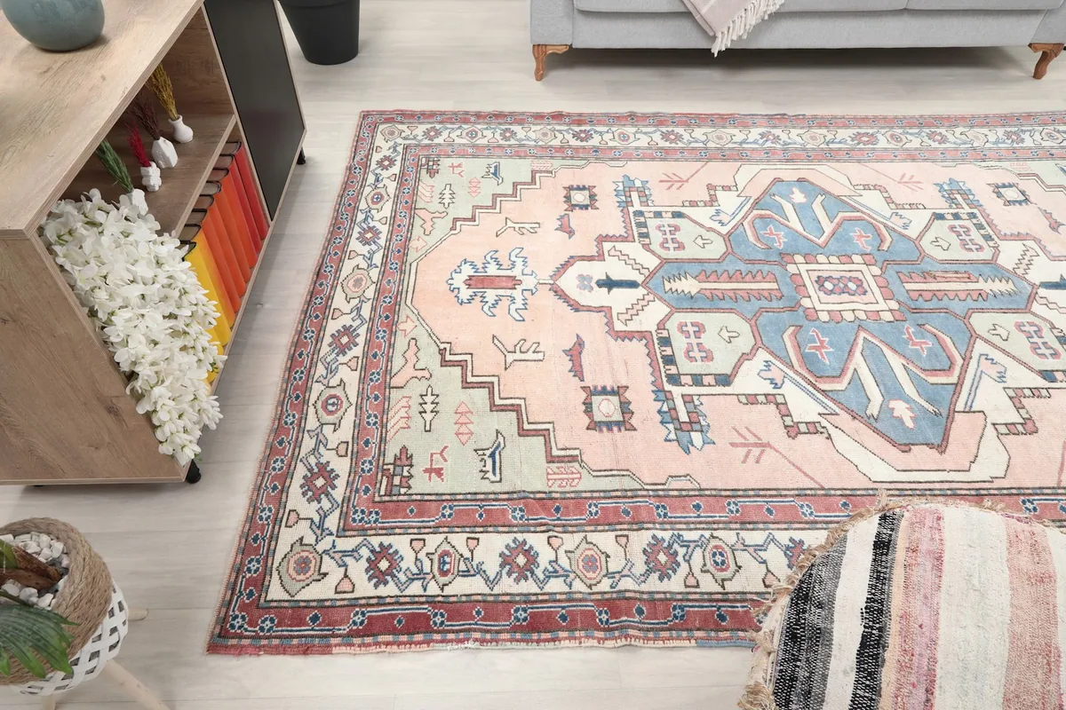 Overhead angle shot of the rug in the living room, capturing the full pattern and colors.