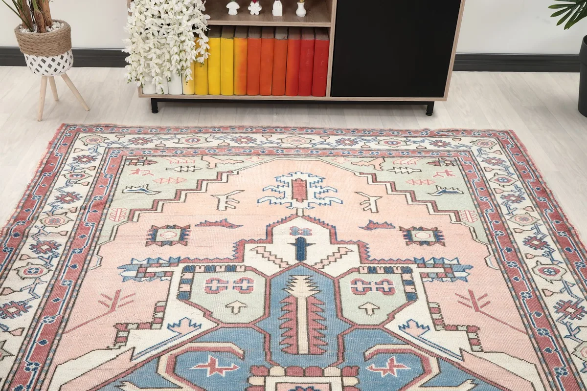 View of the rug from the perspective of a sofa, highlighting its full design in a room setting.