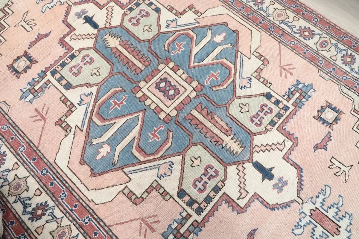 Close-up of the central blue medallion with its intricate geometric design and surrounding rose field.