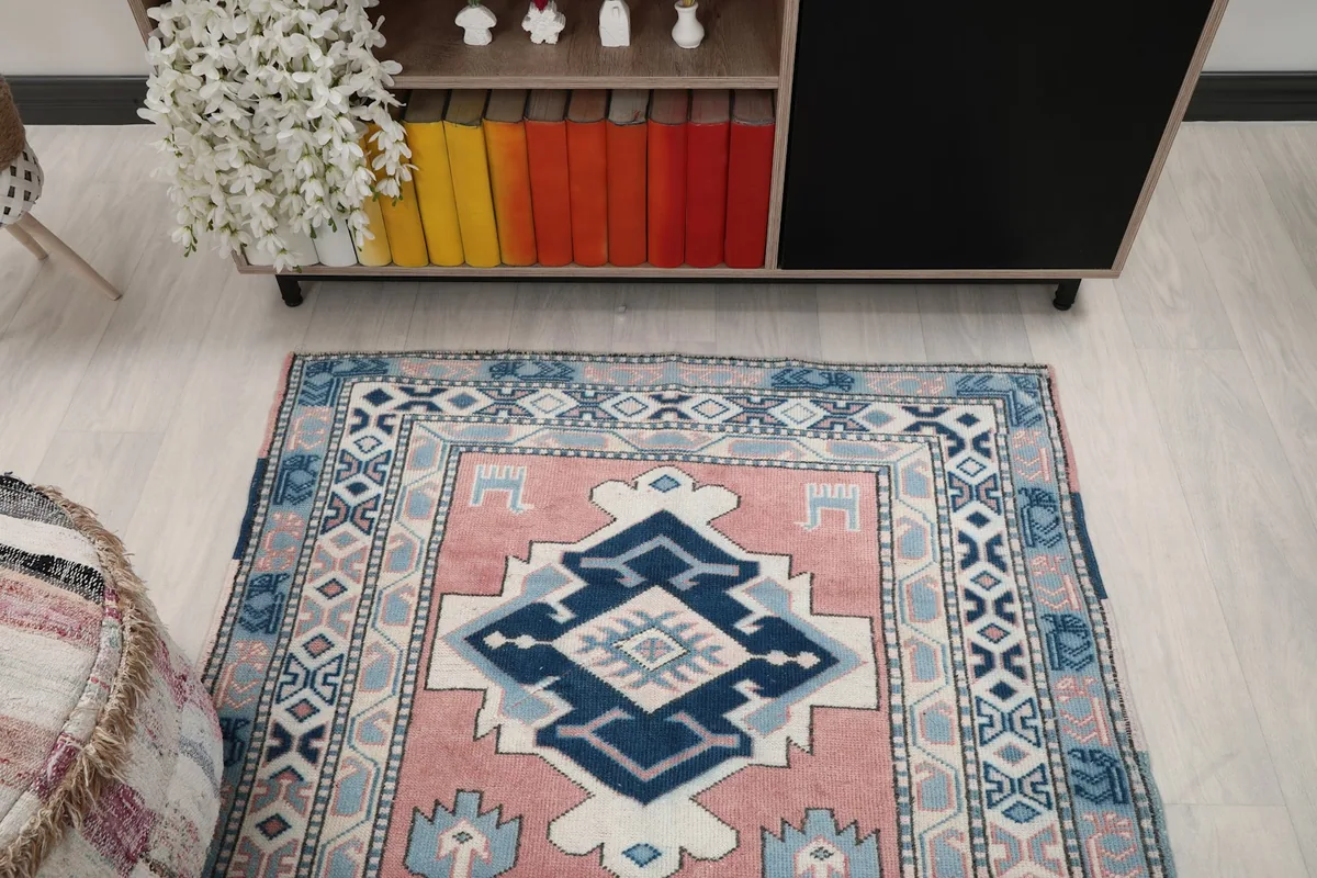 Overhead view of the rug showcasing its full pattern and colors within the room environment.