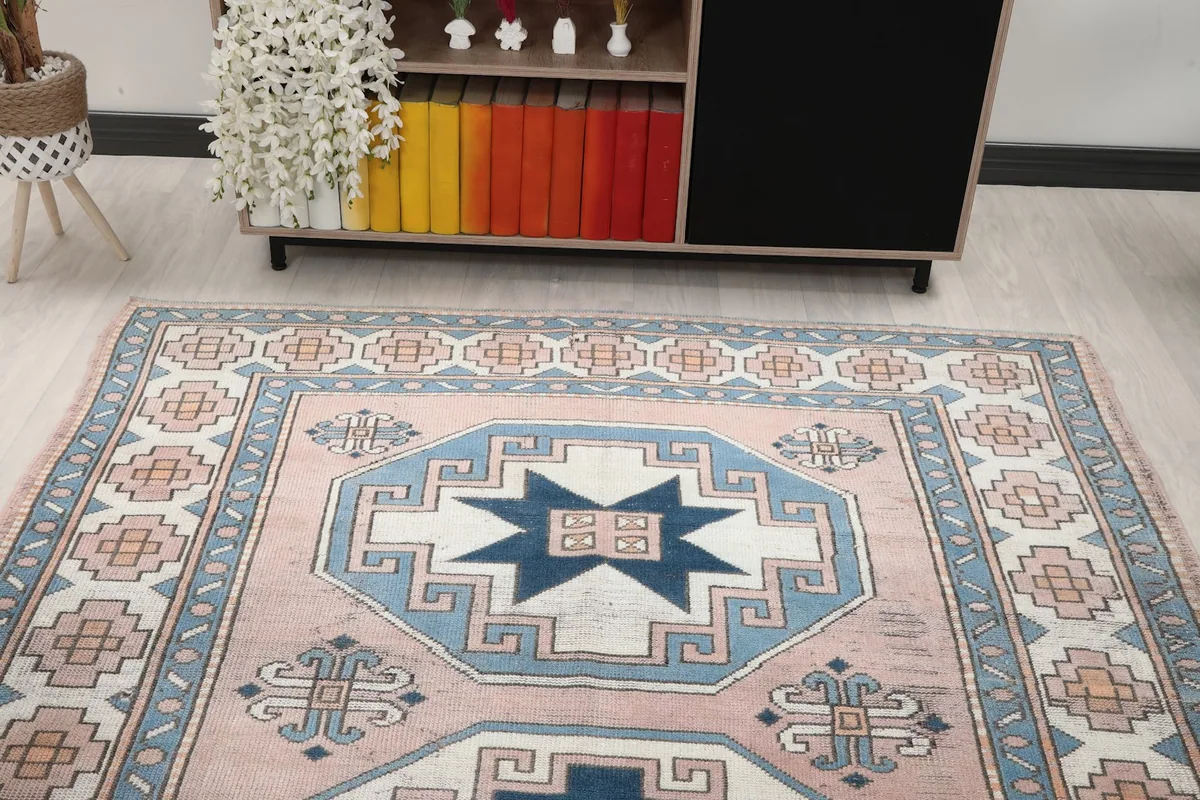 Overhead view of the vintage rug in a living room, focusing on its design and color balance