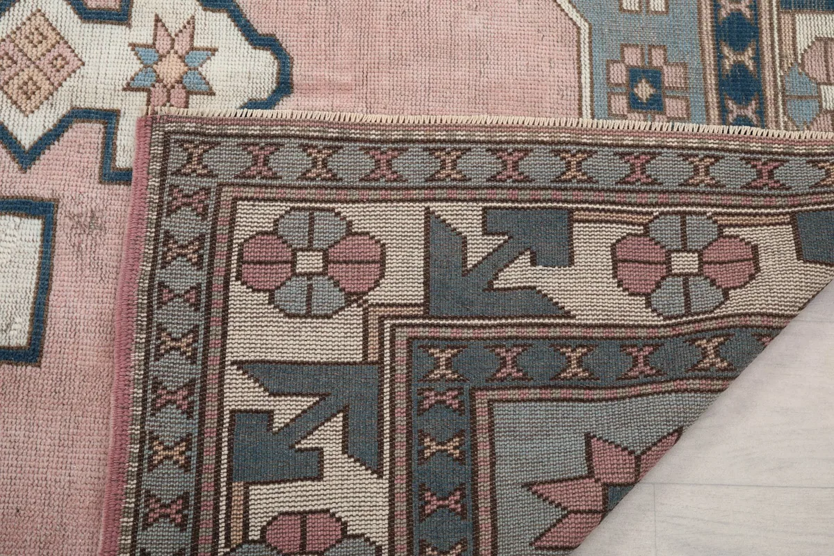 Another folded corner, showing the back of the rug and the tightly woven cotton foundation