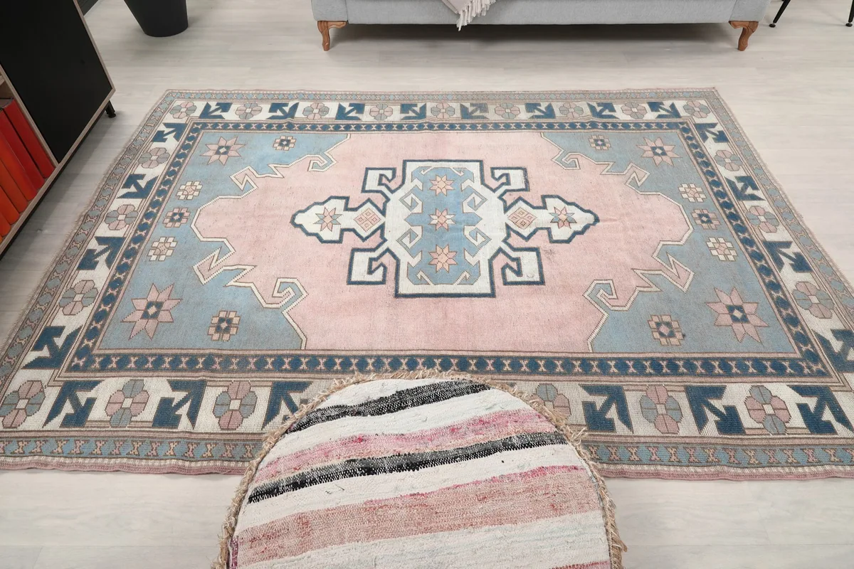 Full overhead shot of the rug on the floor, showing its entire geometric pattern