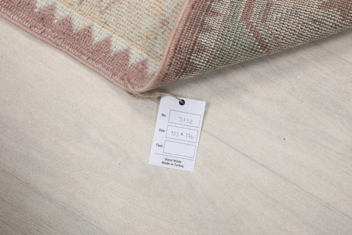 Rug tag displaying size and origin information on the back of the rug