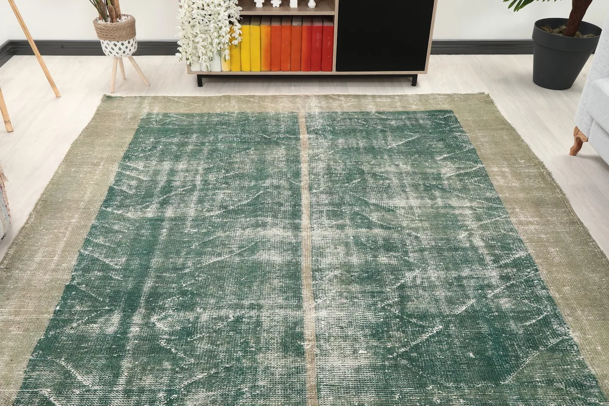 Overhead view of the green and gray vintage rug in a contemporary room setting