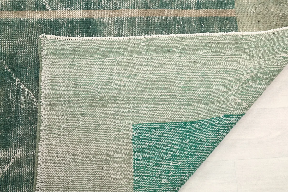Close-up of the back of the rug, revealing the tight knotting and foundation