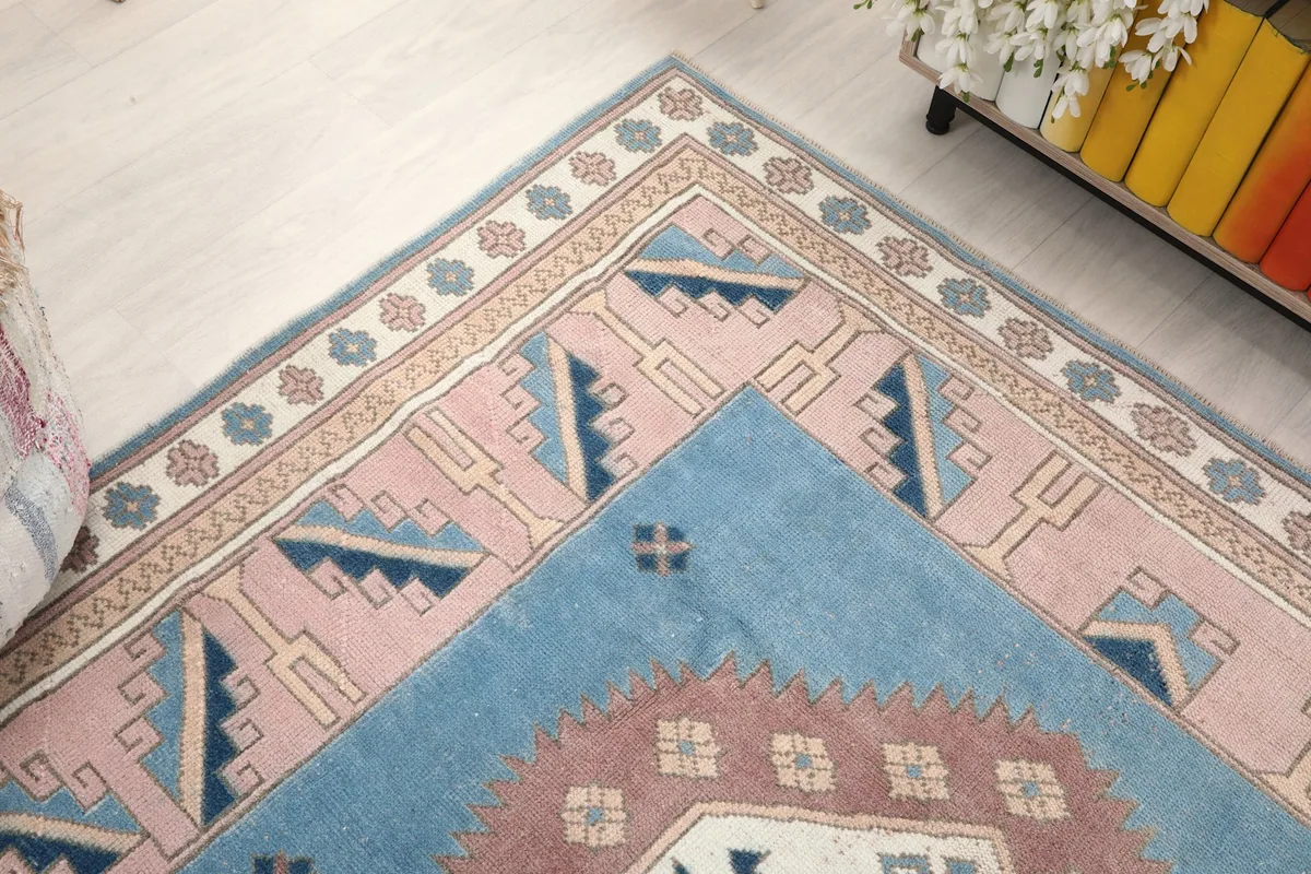 Angled shot of the rug's corner, emphasizing the hand-knotted texture and color variations
