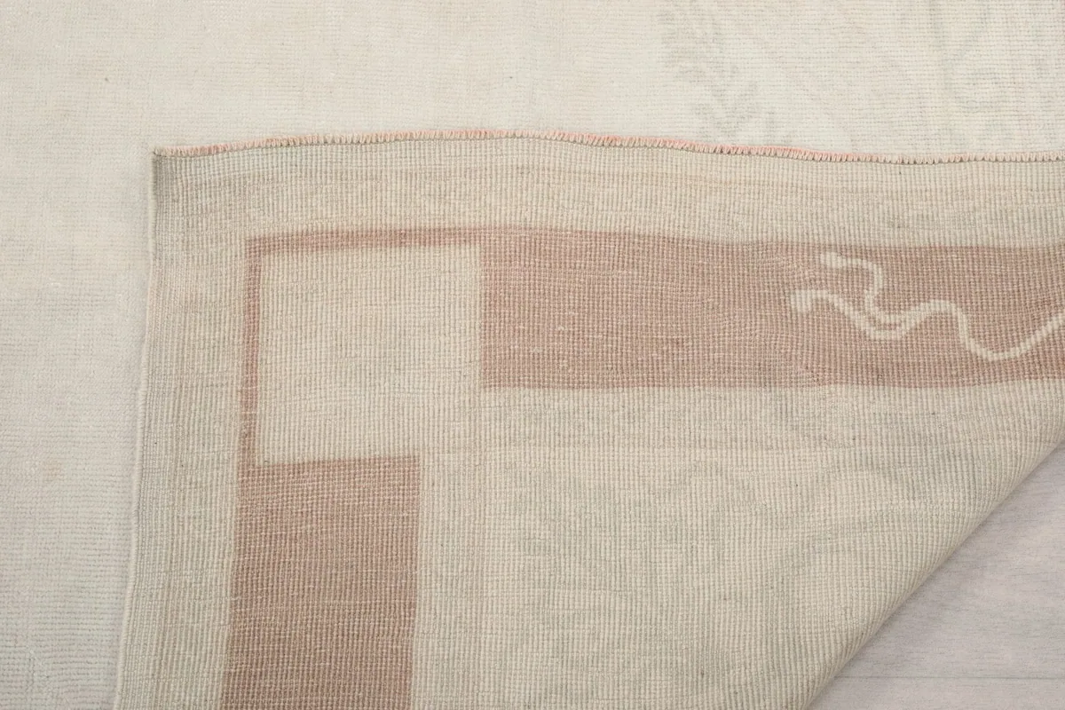 Close-up of the rug's edge and fringe, revealing the natural fiber and construction