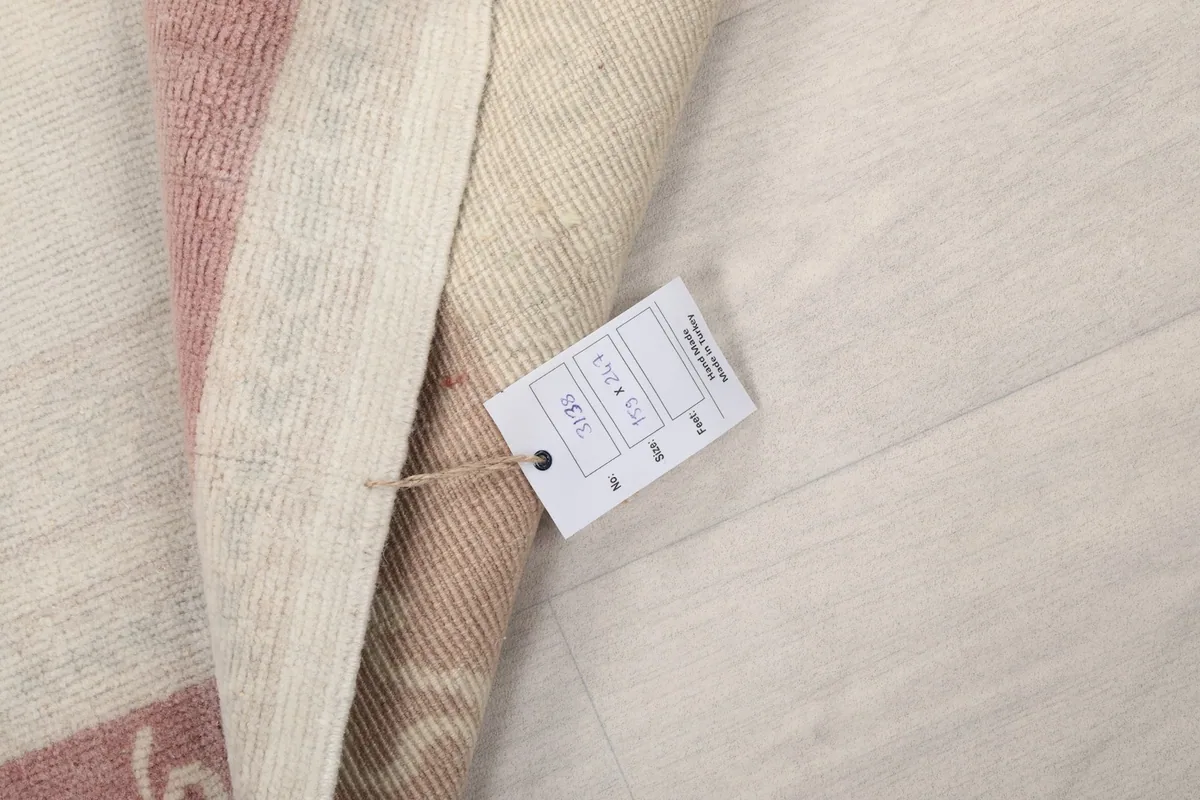 Product tag attached to the rug, displaying size and origin information