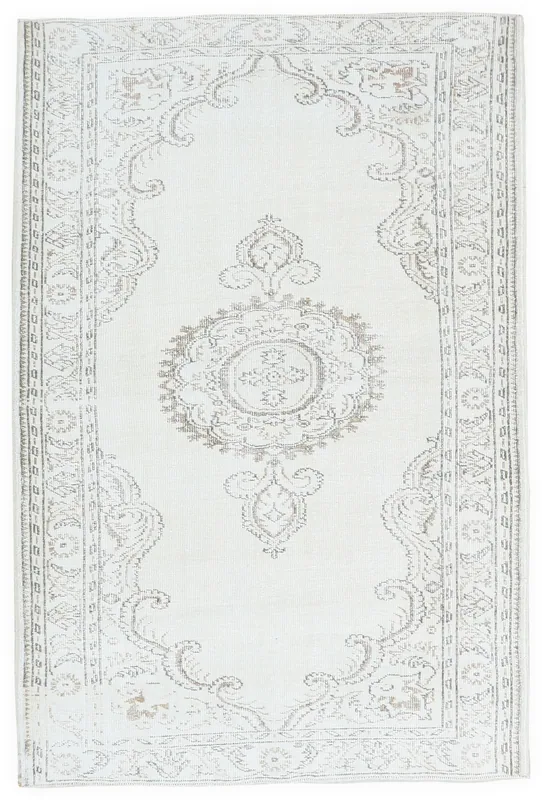 Full overhead view of the 5'2" x 8'4" ivory vintage Anatolian rug with a central medallion