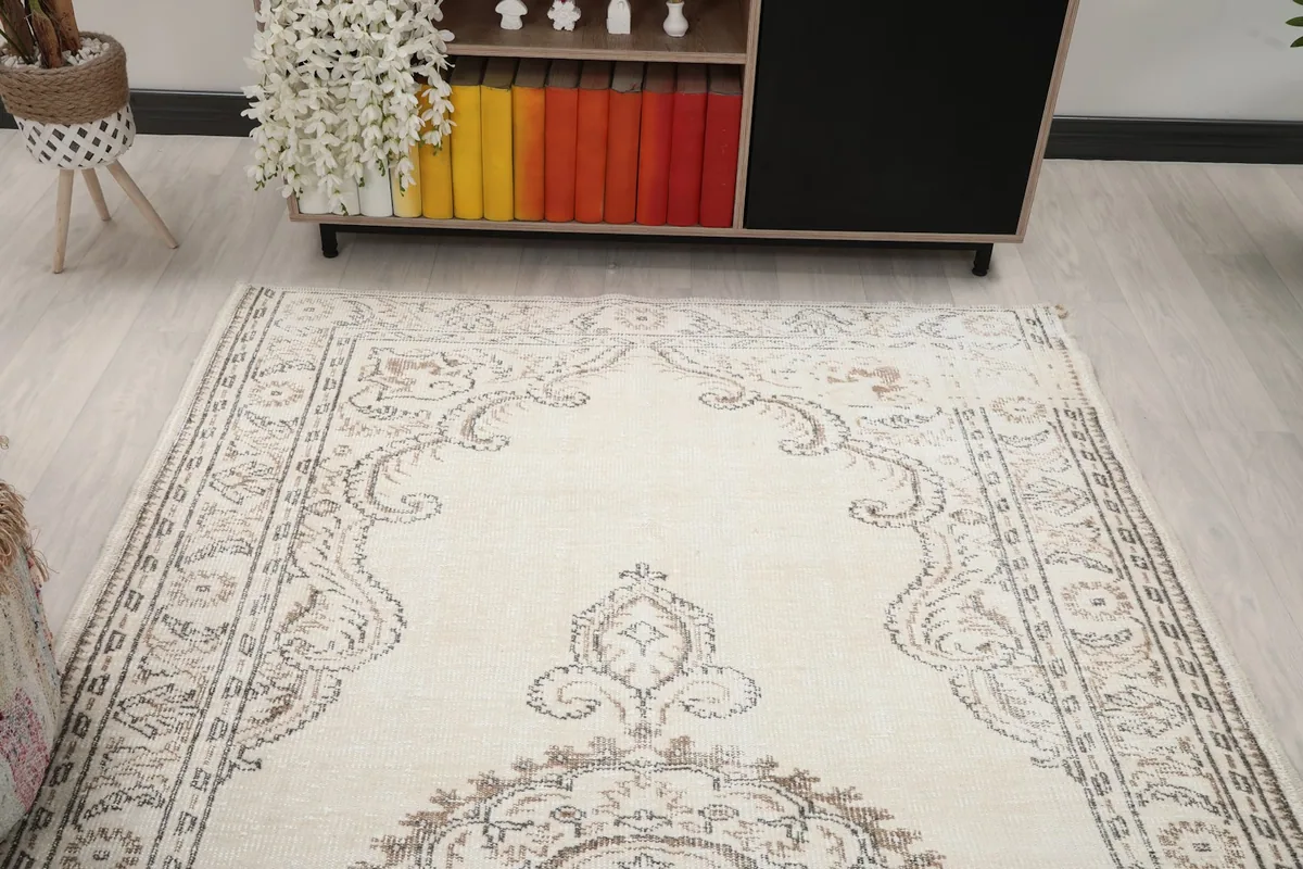 View down the length of the rug, highlighting the central medallion and symmetrical border elements