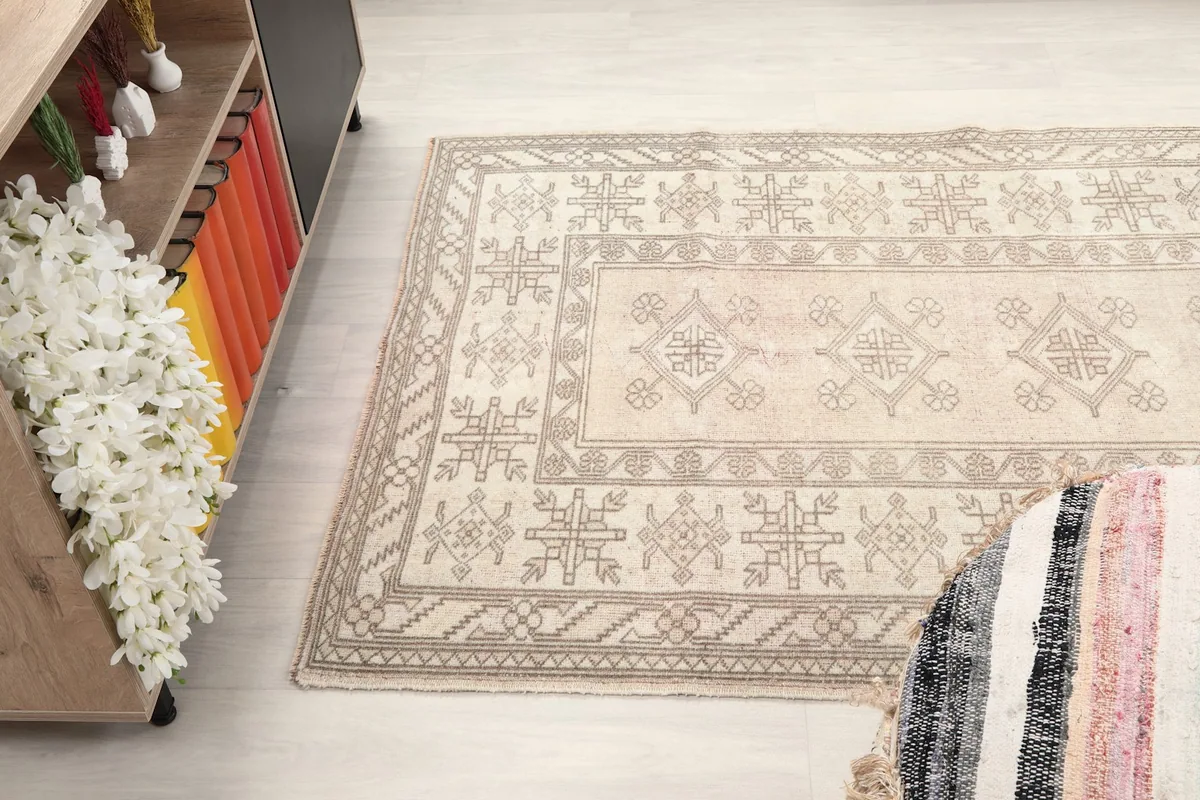 Wide angle view of the rug on the floor, showcasing its full design and surrounding decor.