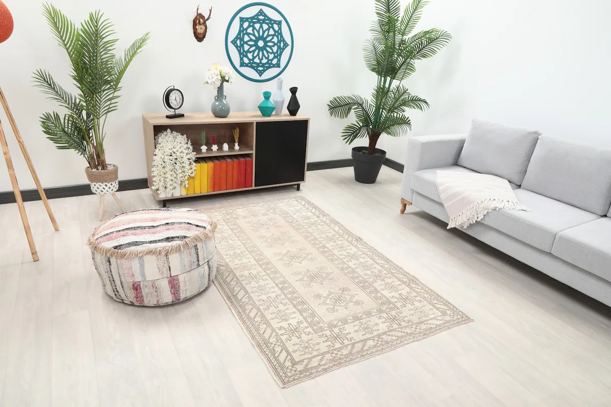 Angle view of the rug in a living room, showing its placement relative to furniture.