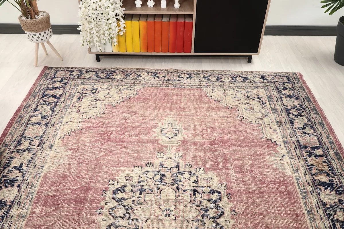 Overhead view of the vintage rug in a room, highlighting its placement
