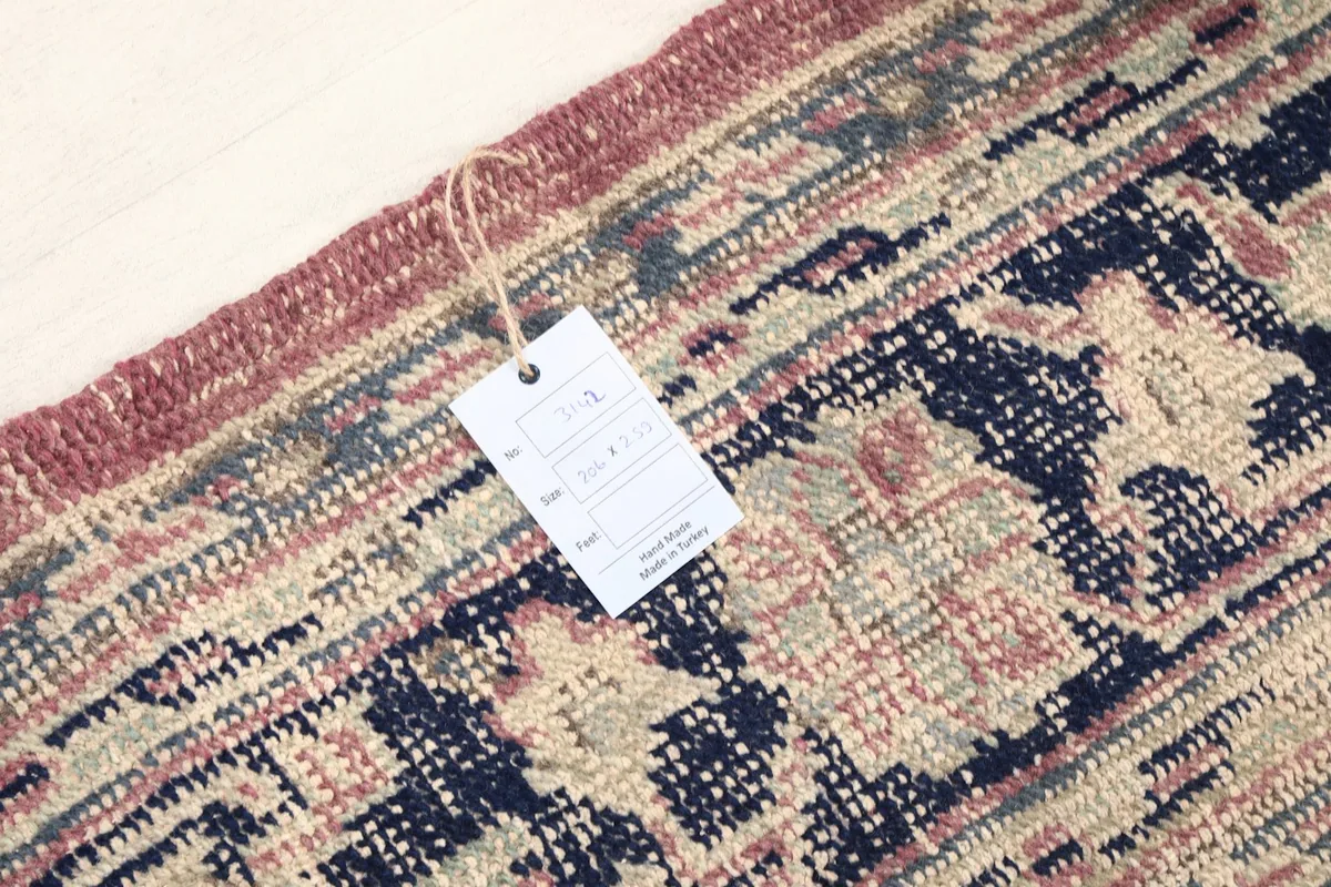 Detail of the rug's edge with a product tag, confirming its authenticity