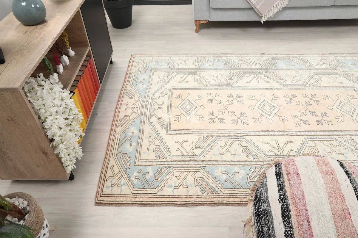 Wide shot of the rug in a room, showing its placement relative to furniture