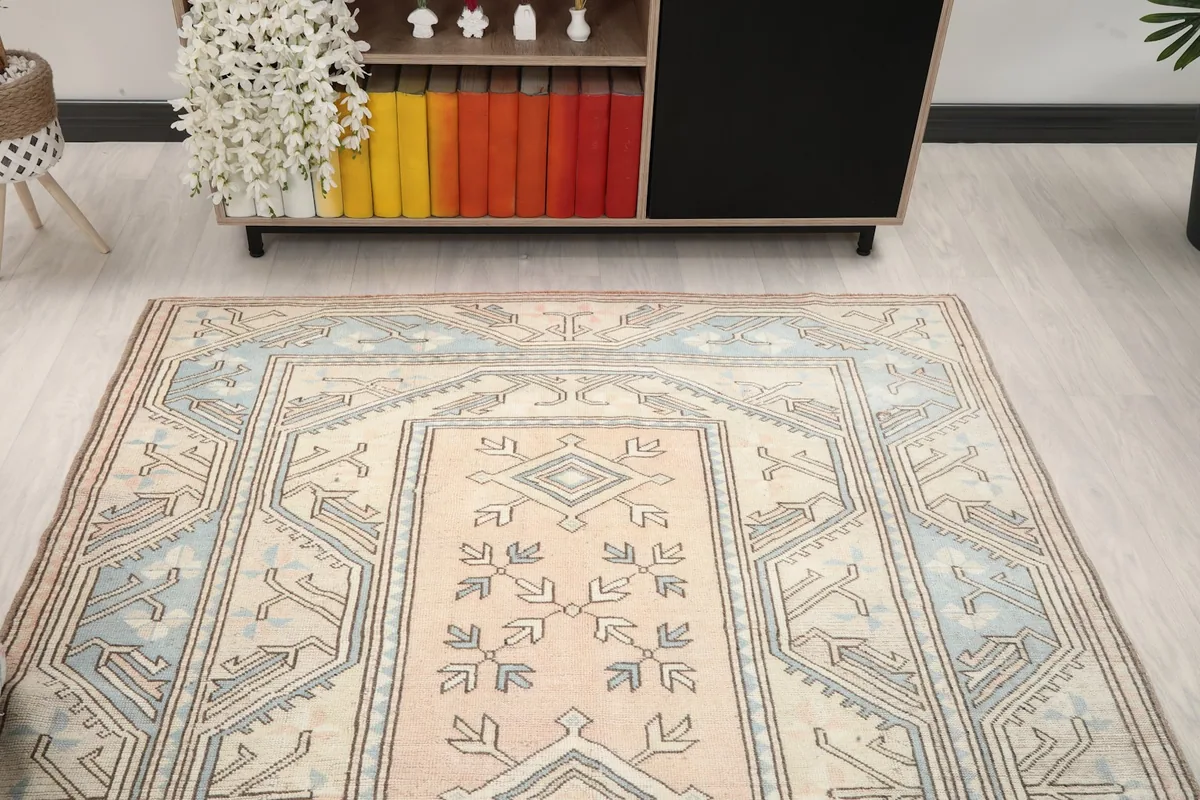Overhead view showing the top half of the rug in a room setting