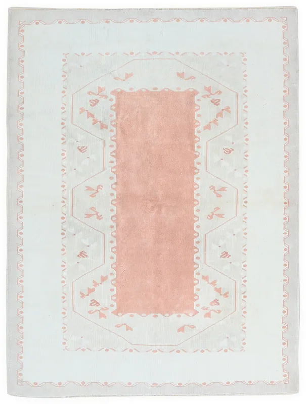 Full top view of the ivory and pink vintage Anatolian rug on a white background