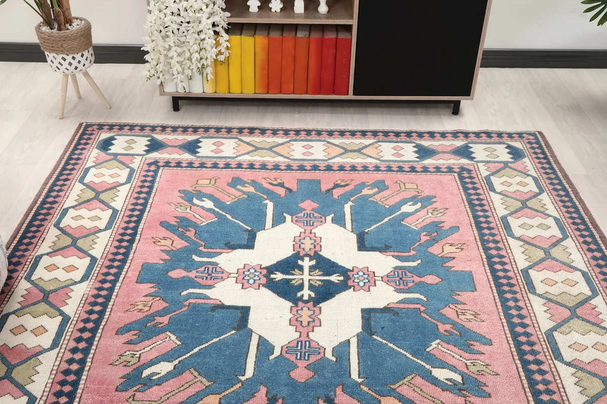 Overhead view of the rug in a room, highlighting the vibrant pink and blue colors