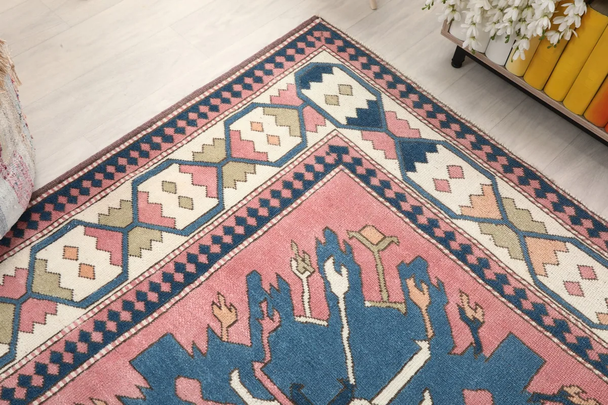 Corner detail of the rug, showing the intricate border patterns and field design