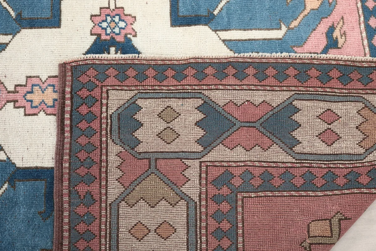 Close-up of the back of the rug, detailing the tight knotting and wool material